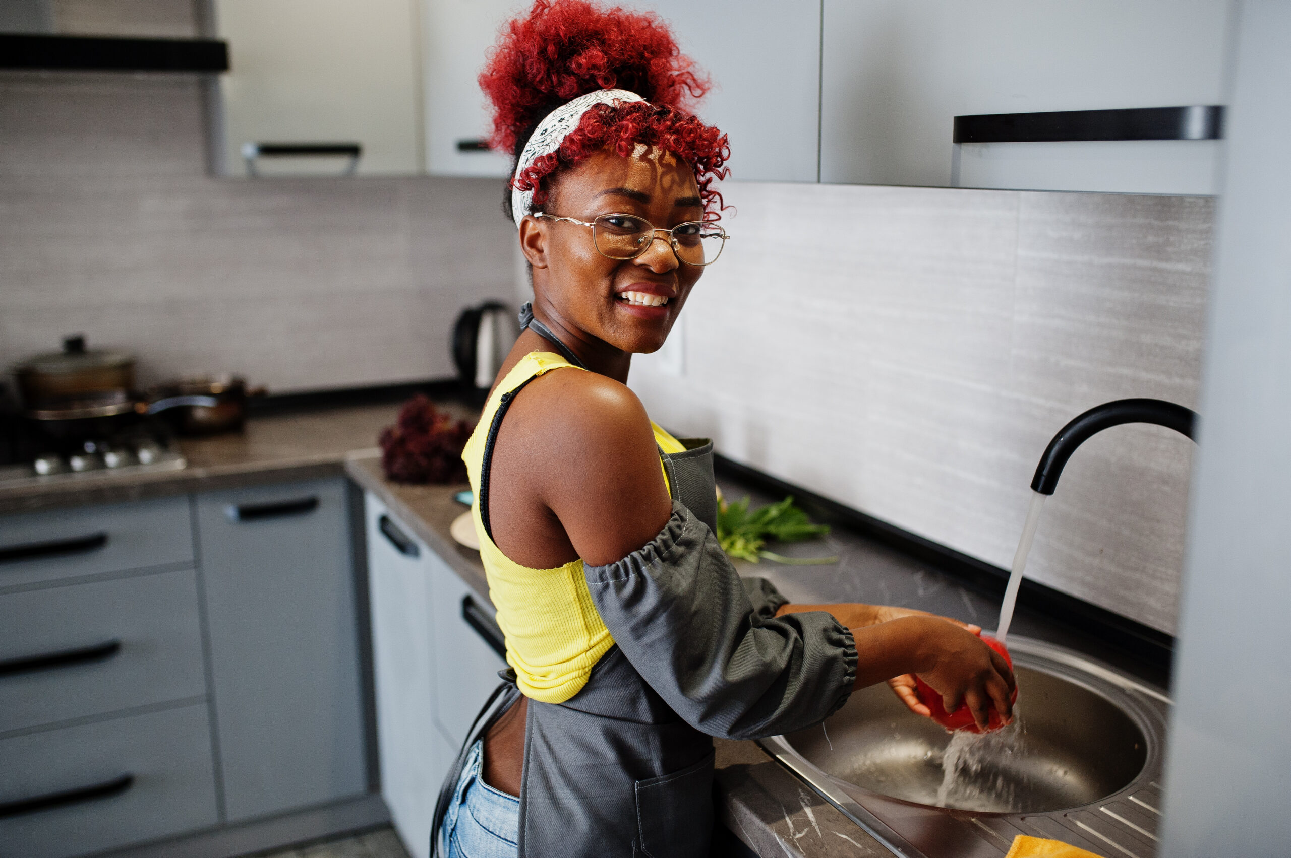 african american woman preparing healthy food at home kitchen. s